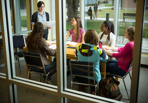 Students working in study rooms