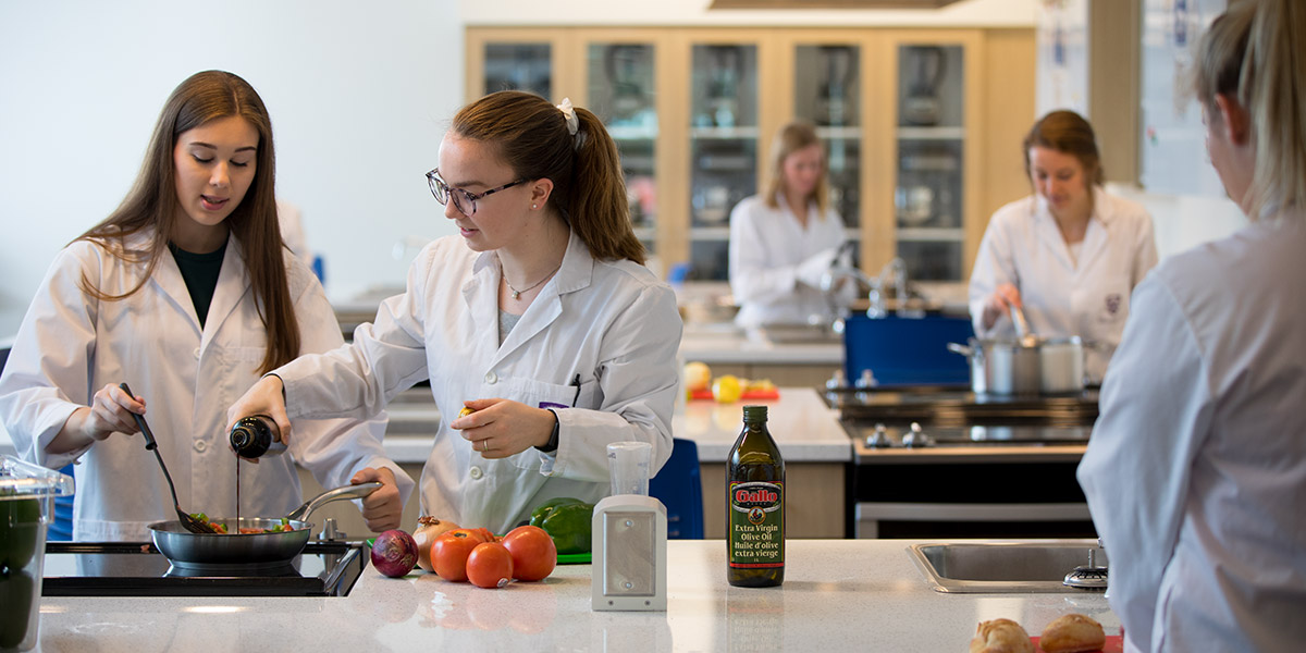 Students cooking in the food labs - nutrition degree